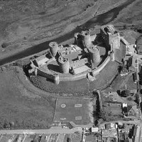 Kidwelly Castle Aerial of view of Kidwelly Castle c.1960, The castle dates from a decision in the very early years of the 12th century to entrust Roger, bishop of Salisbury, as lord of Kidwelly. The castle and adjoining town were built soon after. (source Wikipedia)