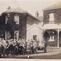Silver Band Mynyddygarreg Silver Band play at Broomhill mansion for Sir Alfred Stephens and family on occasion of Sir Alfred's Knighthood, June 1923. This Image part 0f the Arthur Lewis collection.