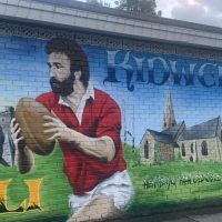 Gravs Mural Ray Gravs Mural on the external wall of Kidwelly Rugby Football Club, painted by Jenks Art 2025